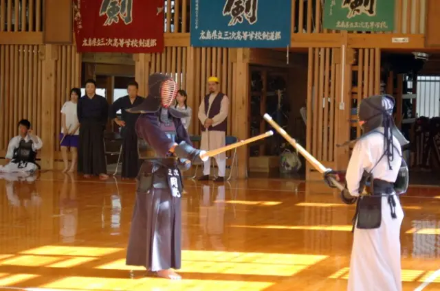 Keiko in a traditional wooden dojo